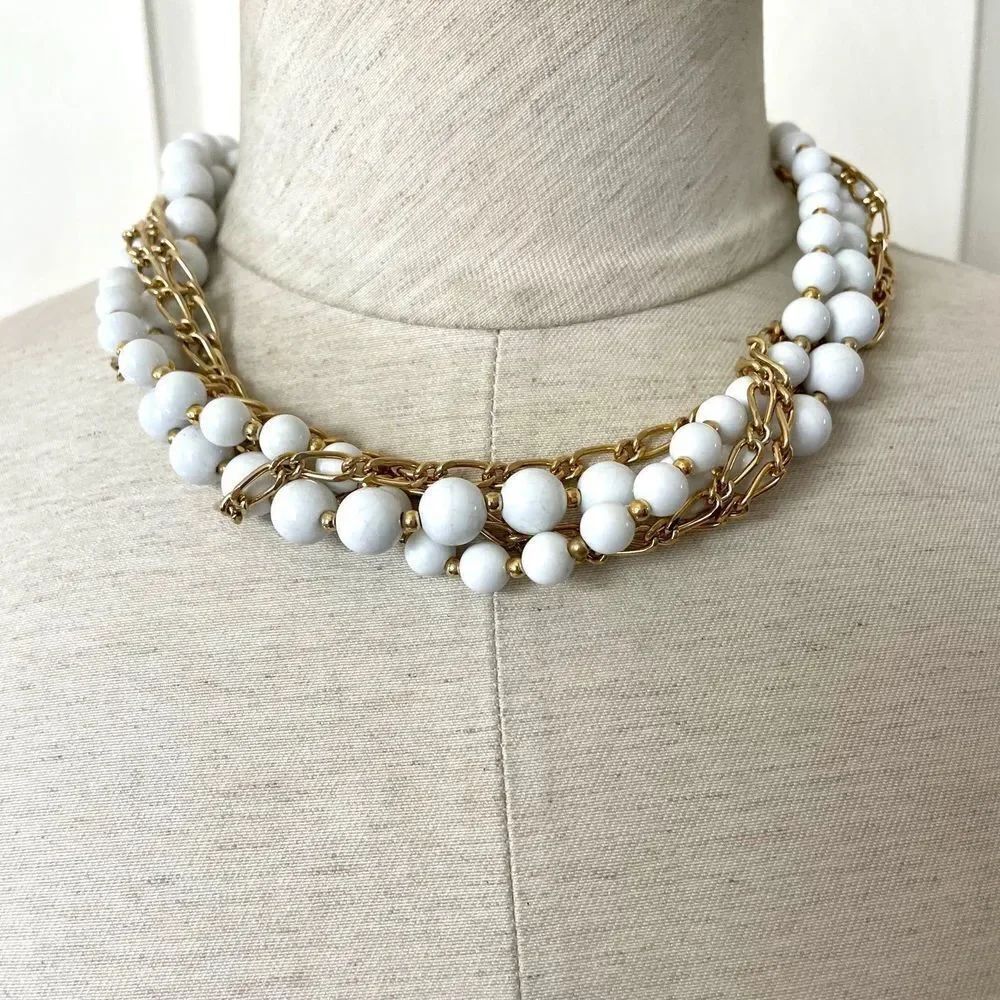 White beaded gold tone multi strand necklace